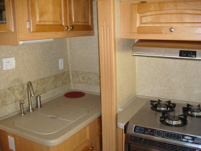 Kitchen and stove with slide out in